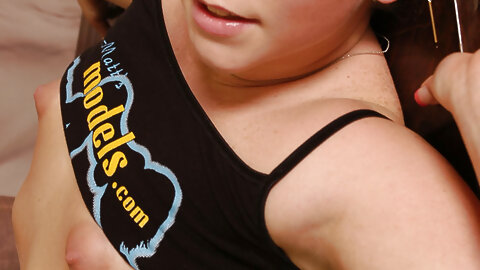 Amateur with long blond hair and a bald twat releases her tiny tits from short