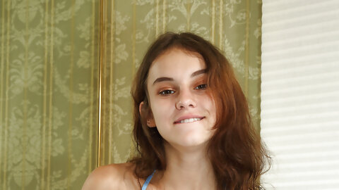 Slim brunette teen Ellie Eilish exposes her tits & sticks candles in her twat