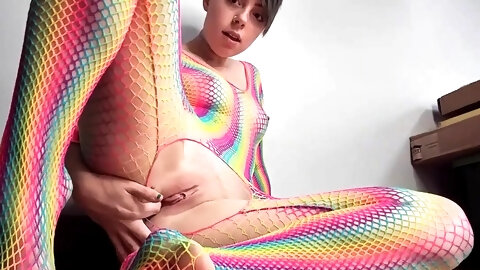 Teen in Rainbow Fishnets Fingers Herself