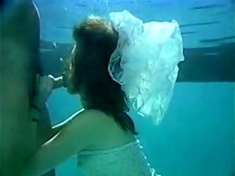 Tasty looking sandy haired torrid tramp invaded sugary penis of her horny guy right in pool while swimming and swallowed it deep throat under water. T